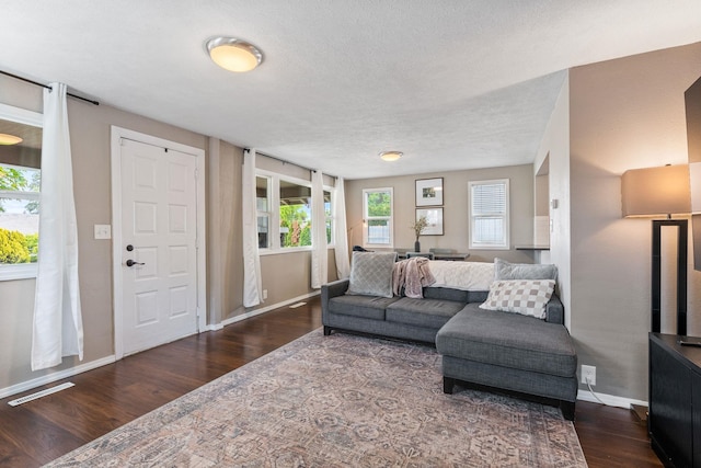 3214 E 29th Ave, Spokane, WA 99223 - living area with wood finished floors, baseboards, and a textured ceiling