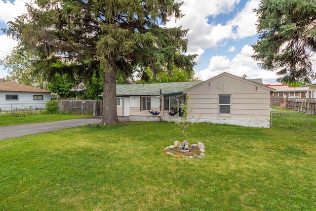 rear view of house featuring driveway