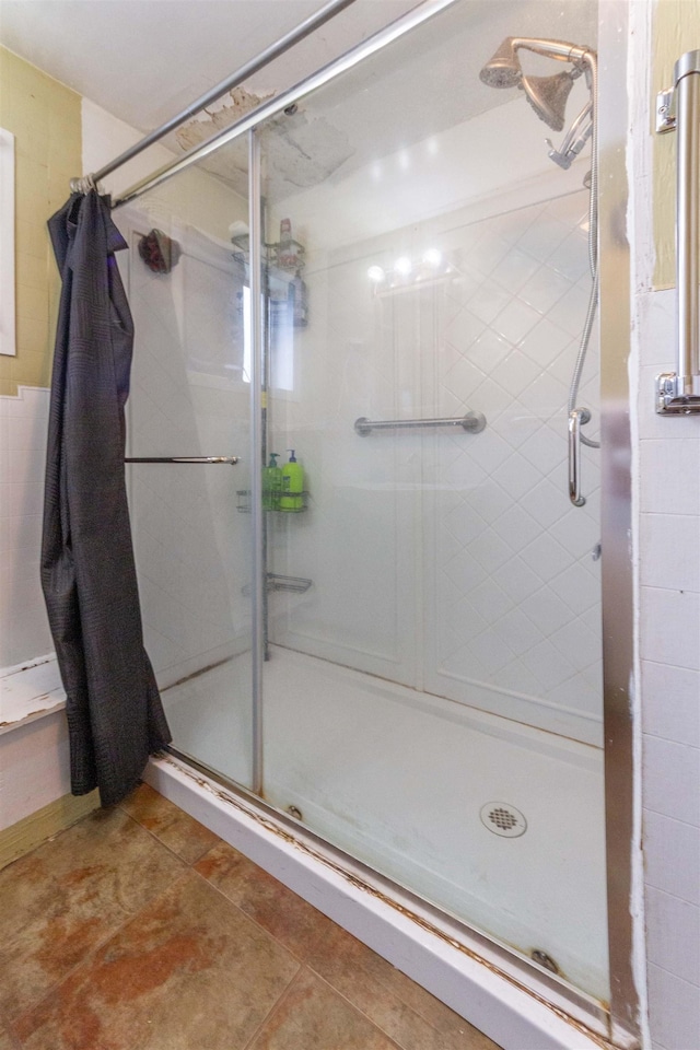 bathroom featuring a stall shower and tile patterned flooring