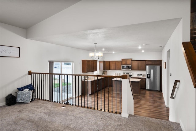 10415 W Salmonberry Rd, Cheney, WA 99004 - kitchen featuring stainless steel appliances, dark carpet, a center island, a chandelier, and open floor plan