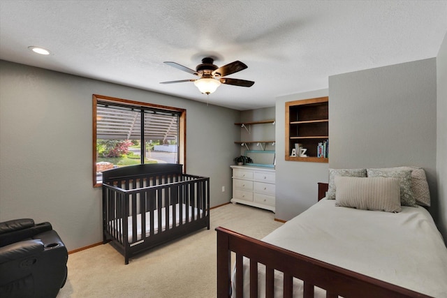 7101 N Greenwood Pl, Spokane, WA 99208 - bedroom featuring light colored carpet, baseboards, a ceiling fan, and a textured ceiling