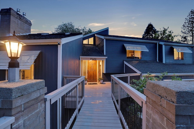 7101 N Greenwood Pl, Spokane, WA 99208 - back of property at dusk featuring roof with shingles