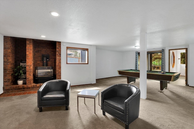 7101 N Greenwood Pl, Spokane, WA 99208 - playroom with carpet flooring, pool table, a wood stove, baseboards, and recessed lighting