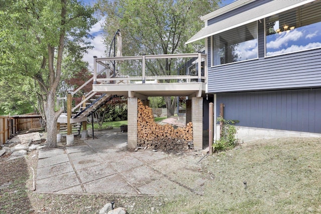 7101 N Greenwood Pl, Spokane, WA 99208 - view of property exterior featuring stairs, fence, a wooden deck, and a patio