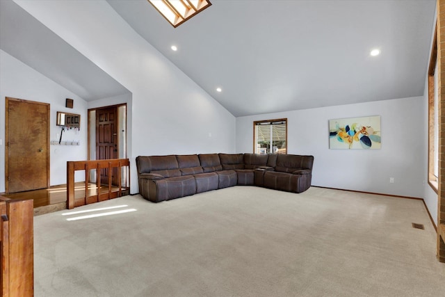 7101 N Greenwood Pl, Spokane, WA 99208 - unfurnished living room with lofted ceiling, carpet floors, a skylight, and recessed lighting