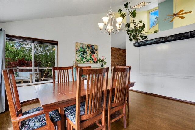 7101 N Greenwood Pl, Spokane, WA 99208 - dining area featuring lofted ceiling, wood finished floors, a chandelier, and a ceiling fan