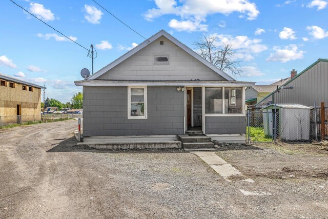 10807 E Trent Ave, Spokane Valley, WA 99206 - view of front of house with fence and a sunroom