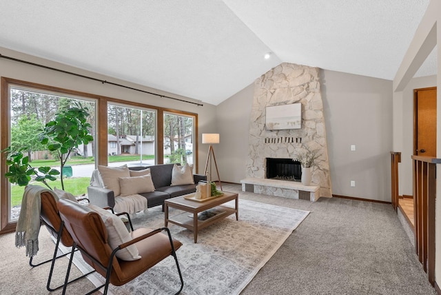 living area featuring vaulted ceiling, a fireplace, light colored carpet, and baseboards