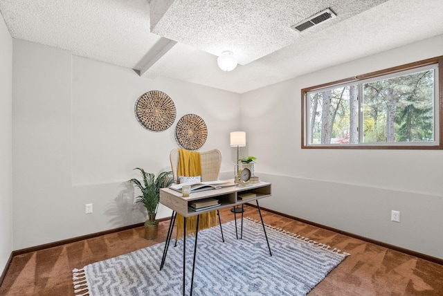 carpeted home office featuring a textured ceiling, baseboards, and beamed ceiling