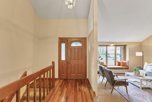 entryway with light wood-type flooring and baseboards