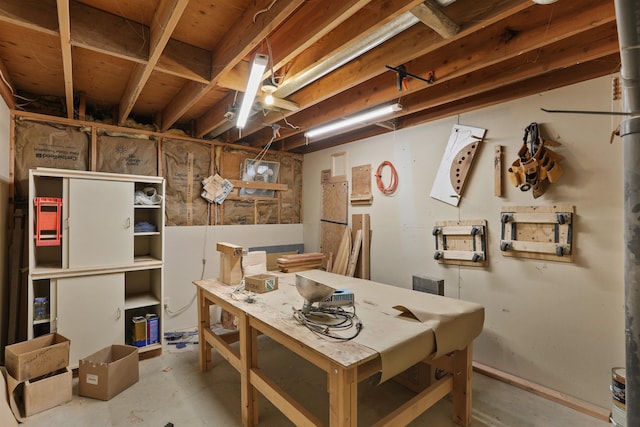 dining space with a workshop area and unfinished concrete floors