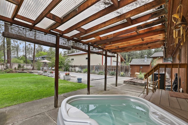 view of pool featuring a patio and an outbuilding