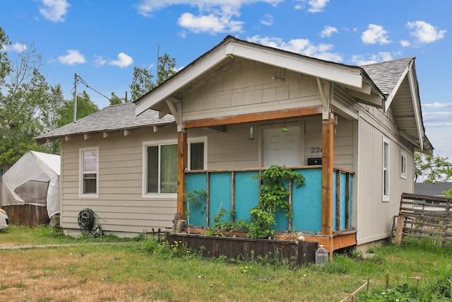 226 E Dalton Ave, Spokane, WA 99207 - view of home's exterior with roof with shingles
