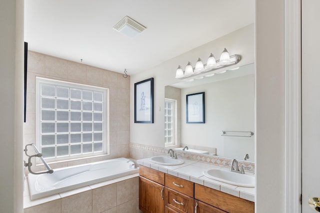 2450 E Black Forest Ave, Post Falls, ID 83854 - bathroom with a bath and double vanity