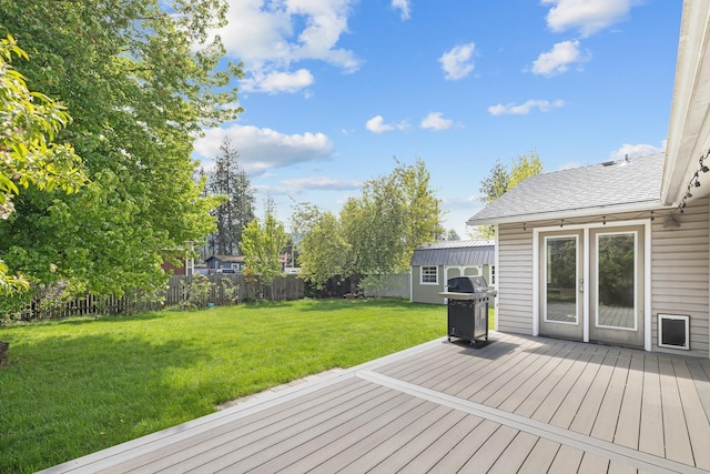 2450 E Black Forest Ave, Post Falls, ID 83854 - deck featuring area for grilling, a shed, and an outbuilding