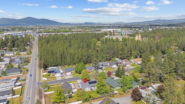 2450 E Black Forest Ave, Post Falls, ID 83854 - aerial view of property's location featuring a mountainous background and nearby suburban area