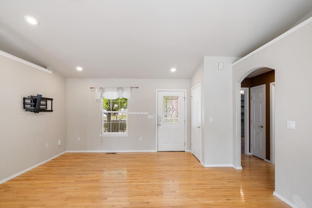 2450 E Black Forest Ave, Post Falls, ID 83854 - foyer entrance featuring arched walkways, light wood-style floors, baseboards, and recessed lighting