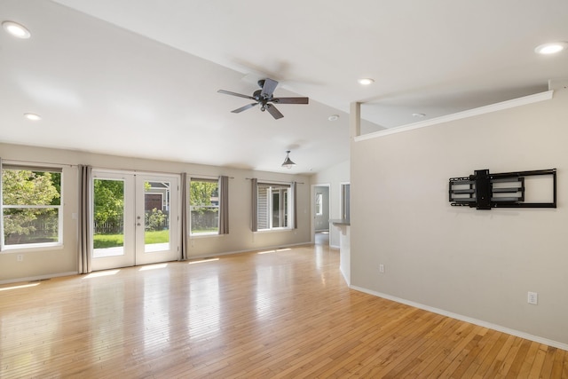 2450 E Black Forest Ave, Post Falls, ID 83854 - unfurnished living room with lofted ceiling, baseboards, a ceiling fan, light wood-style flooring, and recessed lighting
