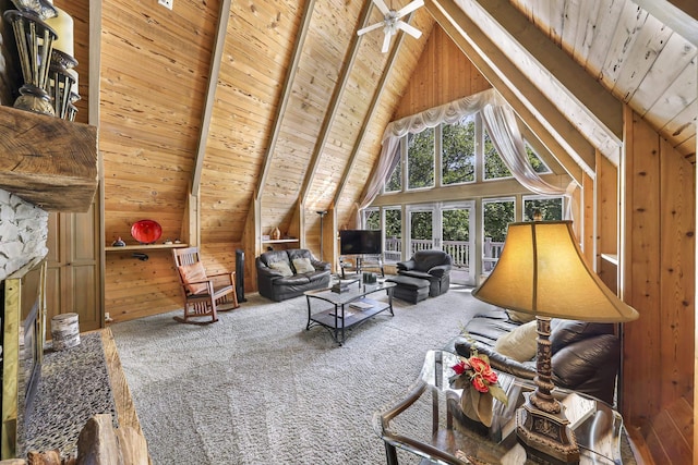 1418 E Blackburn Rd, Wa, WA 98274 - carpeted living area with wood ceiling, wood walls, beamed ceiling, high vaulted ceiling, and a fireplace