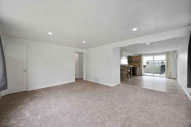 2623 W Olympic Ave, Spokane, WA 99205 - unfurnished living room featuring carpet floors and recessed lighting