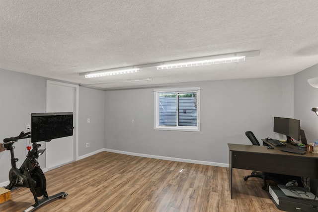 1007 S Bowdish Rd, Spokane Valley, WA 99206 - office area with a textured ceiling, light wood finished floors, and baseboards