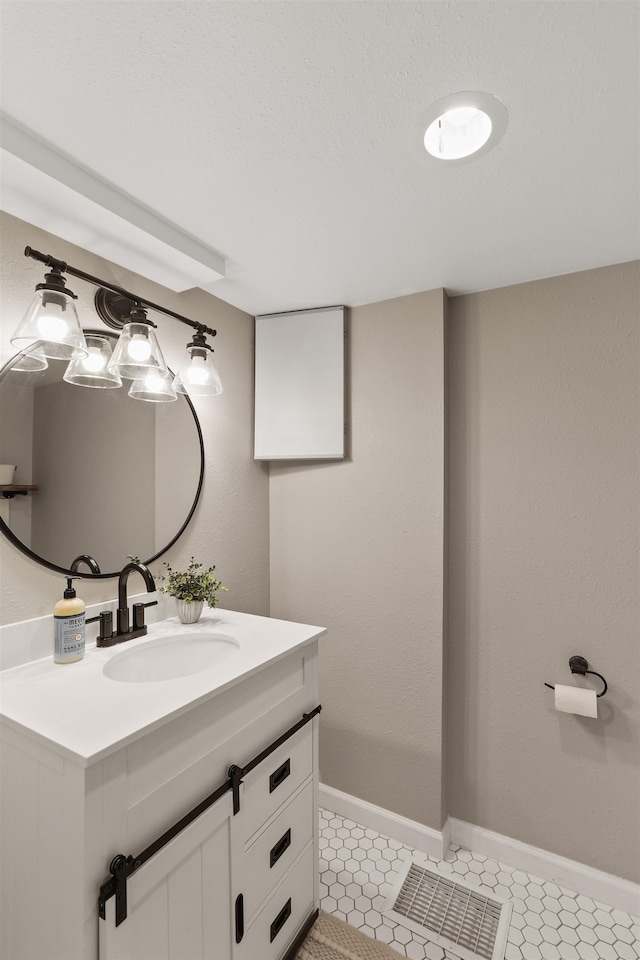 1007 S Bowdish Rd, Spokane Valley, WA 99206 - bathroom with vanity, baseboards, and tile patterned flooring