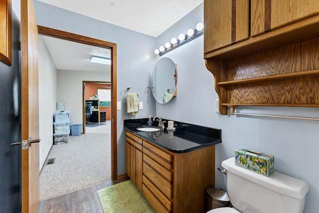16615 W Stoughton Rd, Cheney, WA 99004 - bathroom with toilet, vanity, and wood finished floors