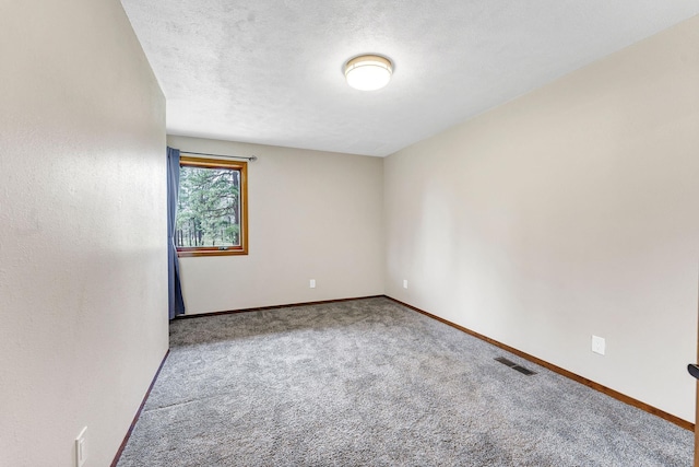 16615 W Stoughton Rd, Cheney, WA 99004 - carpeted spare room featuring baseboards and a textured ceiling