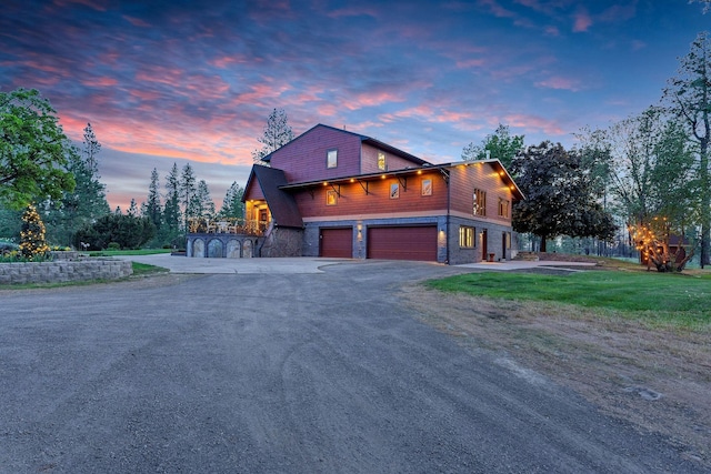 16615 W Stoughton Rd, Cheney, WA 99004 - view of front of home with driveway, a garage, and stone siding