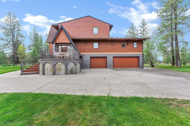 16615 W Stoughton Rd, Cheney, WA 99004 - view of home's exterior featuring stairway, driveway, a garage, and a yard