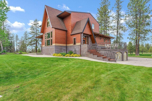 16615 W Stoughton Rd, Cheney, WA 99004 - view of front of property with a front yard, stairway, and a shingled roof