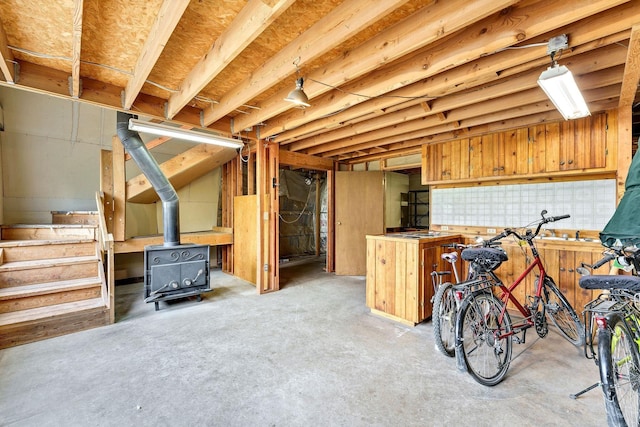 16615 W Stoughton Rd, Cheney, WA 99004 - unfinished below grade area with stairway and a wood stove