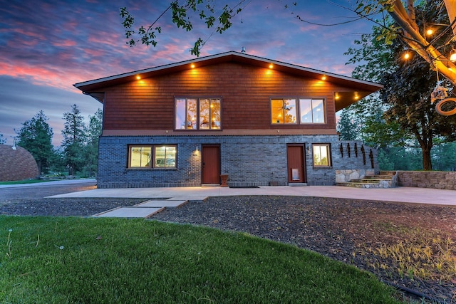 16615 W Stoughton Rd, Cheney, WA 99004 - view of front of property featuring a patio area, brick siding, and a yard