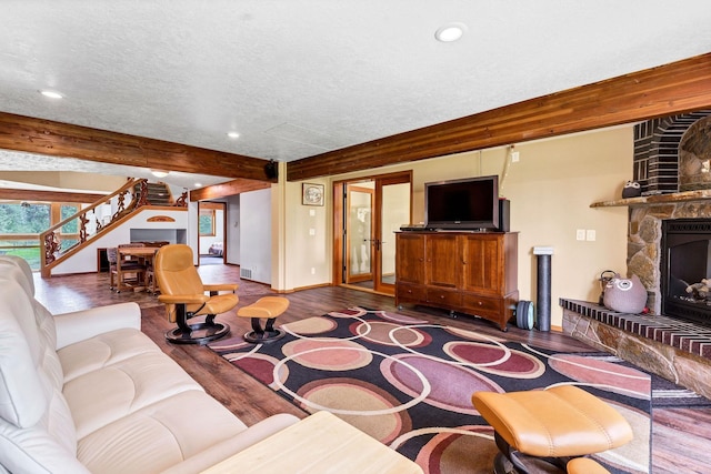 16615 W Stoughton Rd, Cheney, WA 99004 - living area featuring recessed lighting, stairs, wood finished floors, a textured ceiling, and beamed ceiling