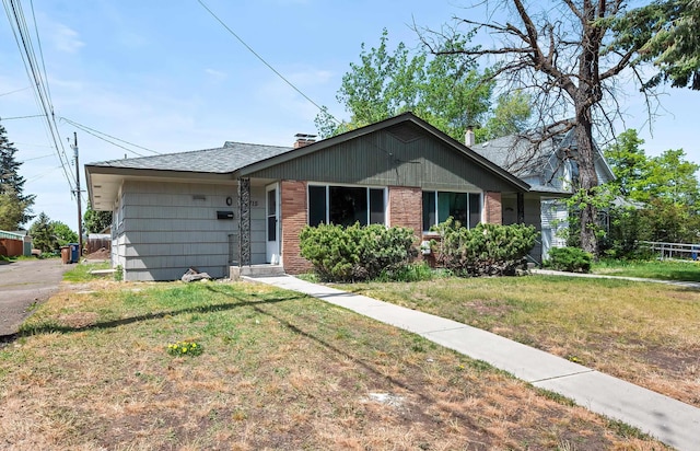 1715 N Jefferson St Unit 1717, Spokane, WA 99205 - ranch-style home with a front lawn, brick siding, a chimney, and a shingled roof