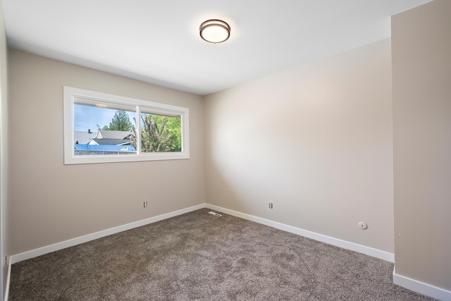 1715 N Jefferson St Unit 1717, Spokane, WA 99205 - spare room with carpet and baseboards