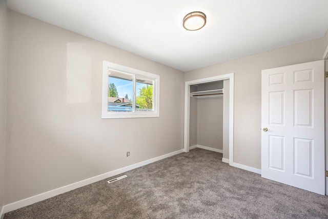 1715 N Jefferson St Unit 1717, Spokane, WA 99205 - unfurnished bedroom with carpet floors, baseboards, and a closet