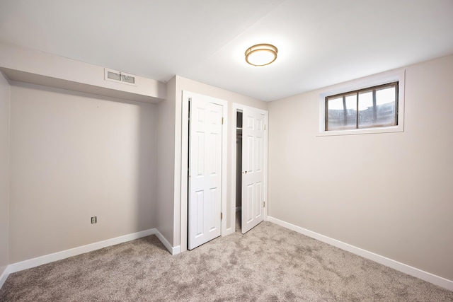 1715 N Jefferson St Unit 1717, Spokane, WA 99205 - unfurnished bedroom featuring light colored carpet, baseboards, and a closet