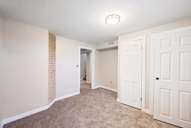1715 N Jefferson St Unit 1717, Spokane, WA 99205 - unfurnished bedroom featuring light carpet and baseboards