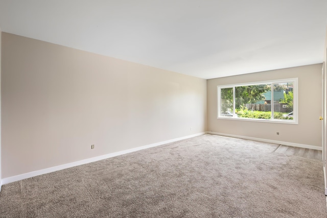 1715 N Jefferson St Unit 1717, Spokane, WA 99205 - carpeted empty room featuring baseboards