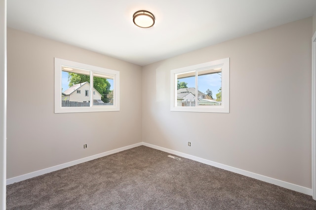 1715 N Jefferson St Unit 1717, Spokane, WA 99205 - unfurnished room with baseboards and dark carpet