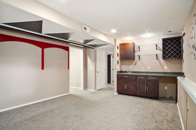1104 S Comax Ct, Spokane, WA 99224 - basement featuring light carpet, a sink, and baseboards