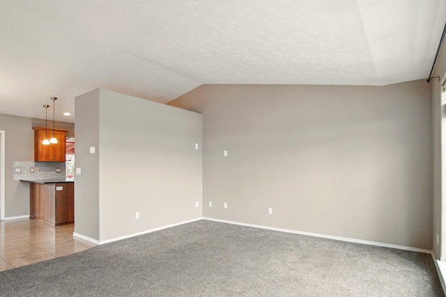 1104 S Comax Ct, Spokane, WA 99224 - spare room with light carpet, baseboards, recessed lighting, and vaulted ceiling