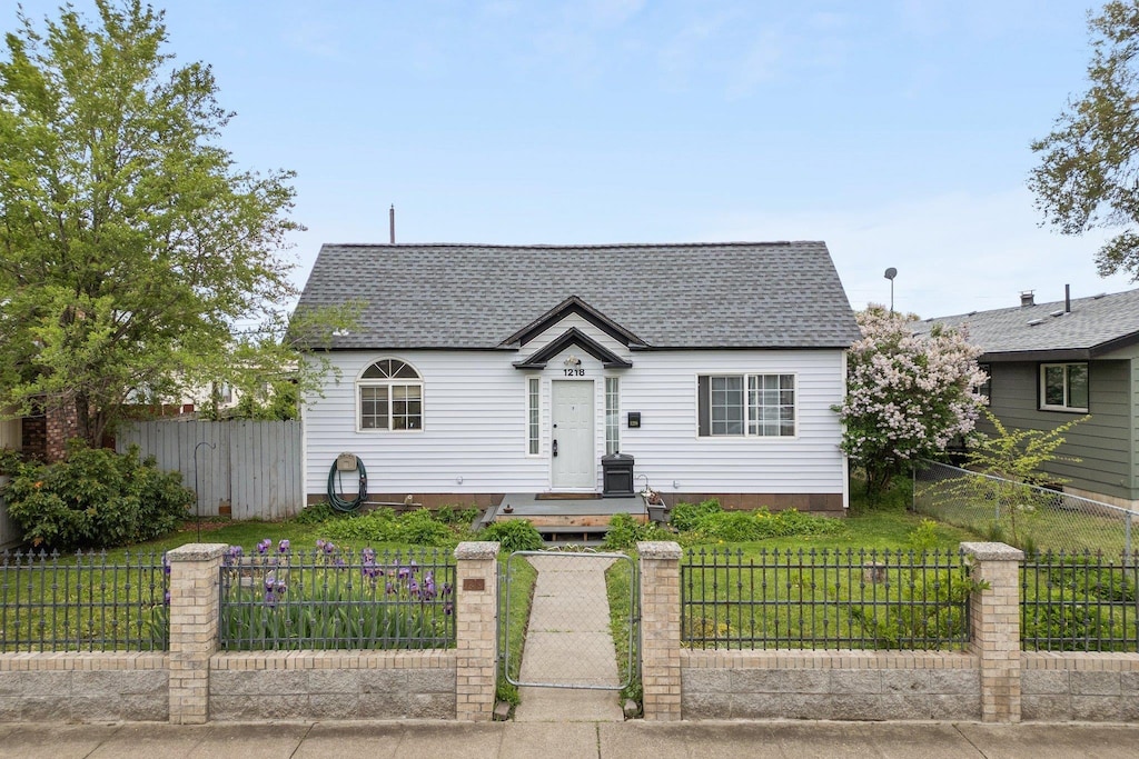 1218 E Broad Ave, Spokane, WA 99207 - view of front of home with a shingled roof