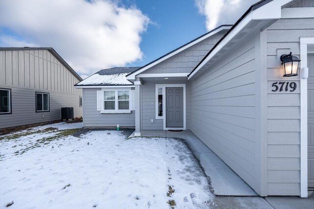 5719 S Lancer Rd, Spokane, WA 99224 - snow covered property entrance featuring cooling unit