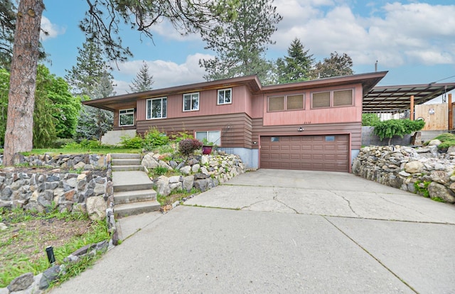 2033 S Rebecca St, Spokane, WA 99223 - view of front of home featuring a garage and driveway
