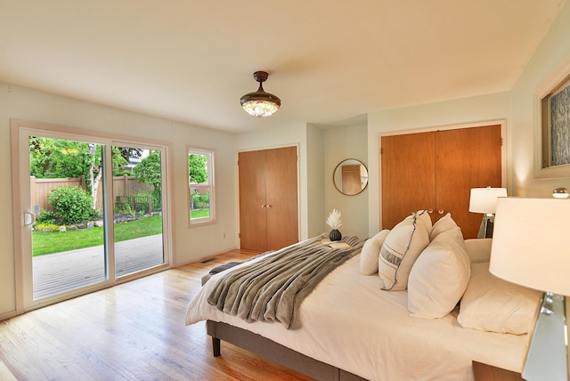 2033 S Rebecca St, Spokane, WA 99223 - bedroom with access to exterior, wood finished floors, and two closets