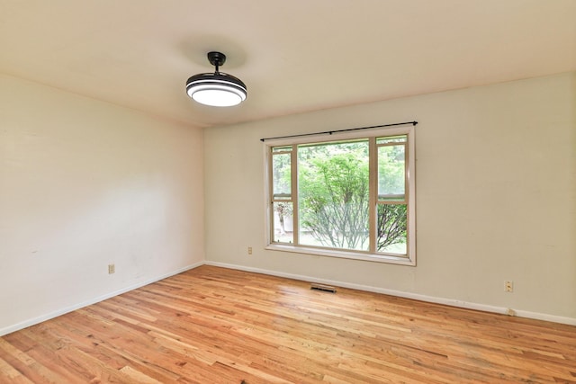 2033 S Rebecca St, Spokane, WA 99223 - unfurnished room with light wood-style floors and baseboards