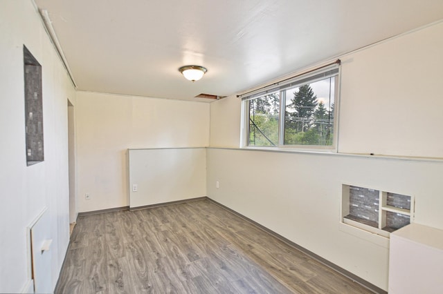 2033 S Rebecca St, Spokane, WA 99223 - unfurnished room with wood finished floors