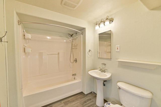 2033 S Rebecca St, Spokane, WA 99223 - full bathroom with wood finished floors, toilet, and shower / bathtub combination